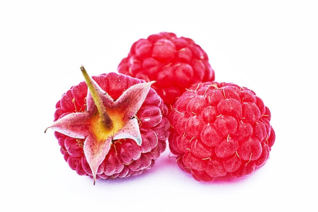 Ripe raspberries isolated on white surface cutout