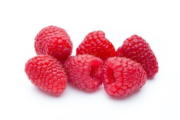 Ripe raspberries isolated on white surface.