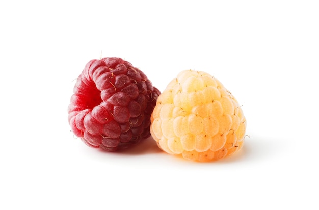 Ripe raspberries of two types yellow and red isolated on a white background