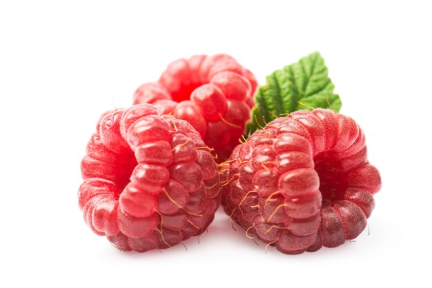 Ripe raspberries with green leaf