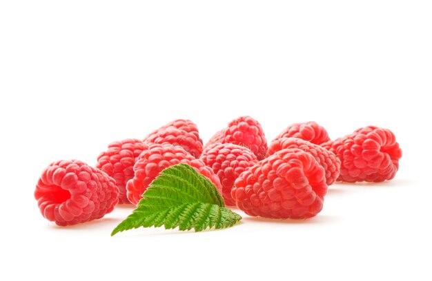 Ripe raspberries with green leaf