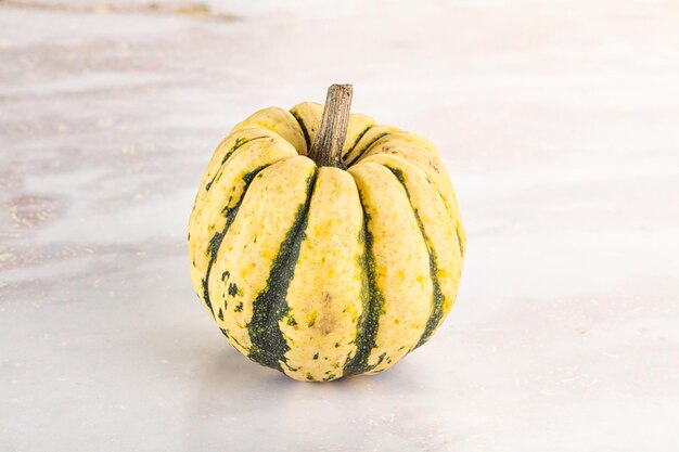 Ripe raw fresh decorative pumpkin