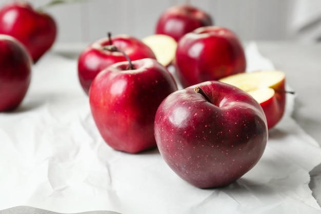 Ripe red apples on table