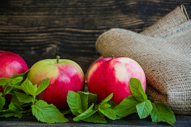 Ripe red apples with mint.