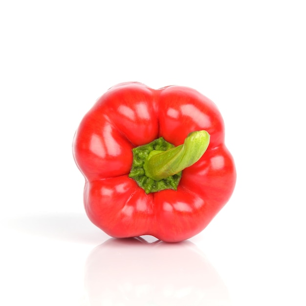 Ripe red bell pepper on white background