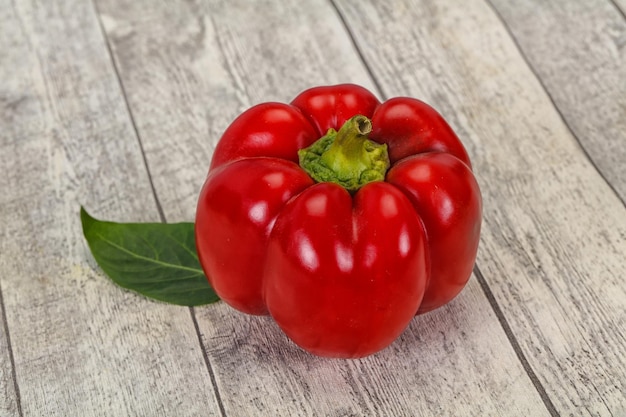 Ripe Red bell pepper over wooden