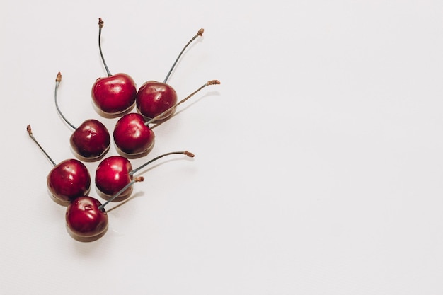 Ripe red cherries in on white table