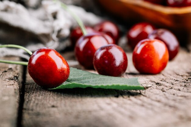 Ripe red cherries on a wooden table