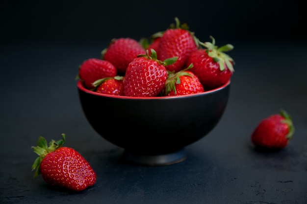 Ripe red fresh strawberries in a bowl