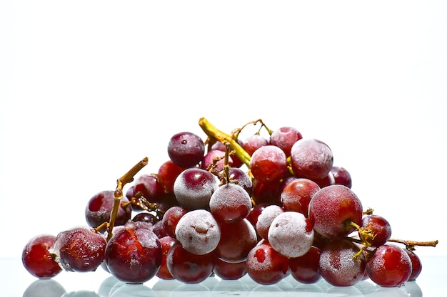 Ripe red grape isolated on white background, depth of field. 