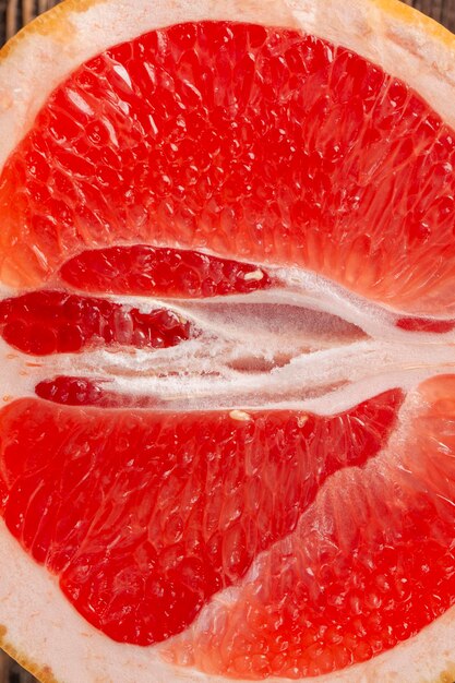 Ripe red grapefruit sliced and sliced into pieces