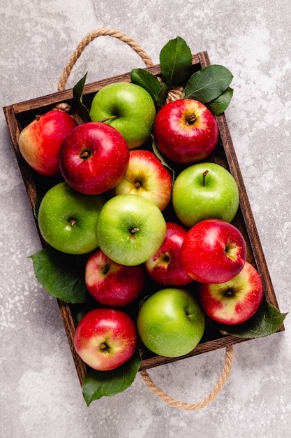 Ripe red and green apples in wooden box.Top view with copy space.