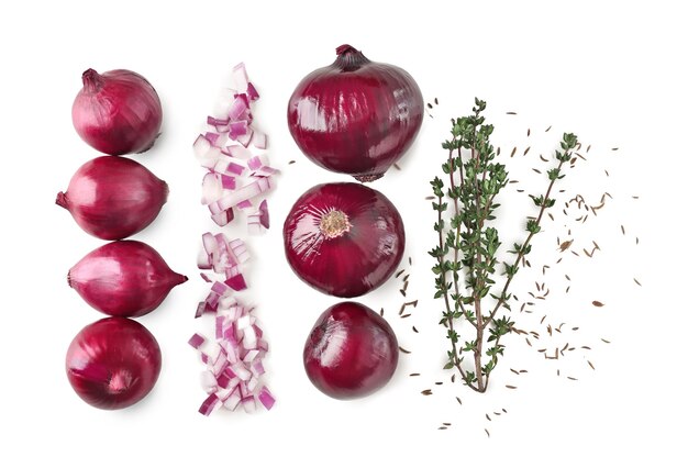 Ripe red onions and thyme on white background