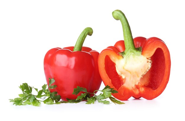 Ripe red peppers on white