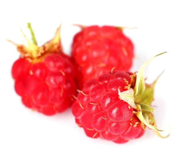Ripe red raspberries isolated on white