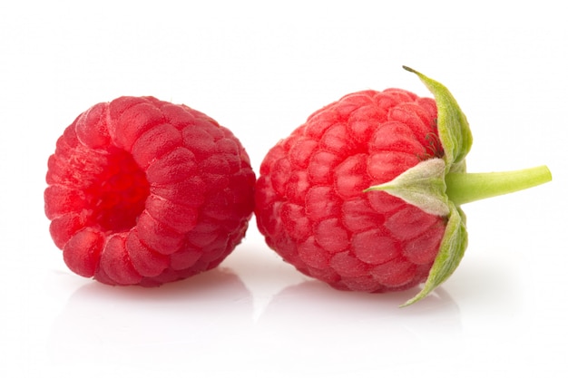 Ripe red raspberries isolated on white