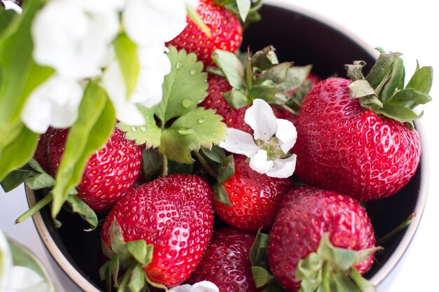 Ripe red strawberries on a plate Summer harvest