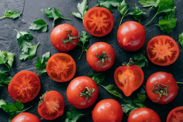  Ripe red tomatoes and green parsley harvested from garden. 