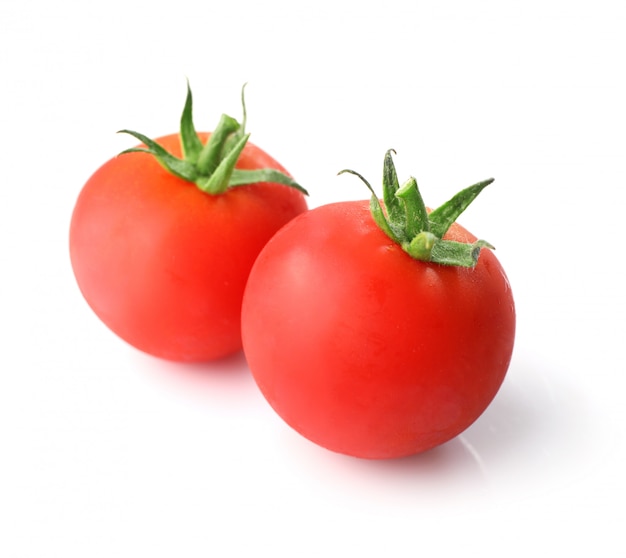 Ripe red tomatoes isolated on white background