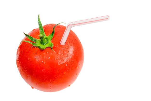 Ripe red tomatoes with drops and with a straw from the juice on a white background Isolated