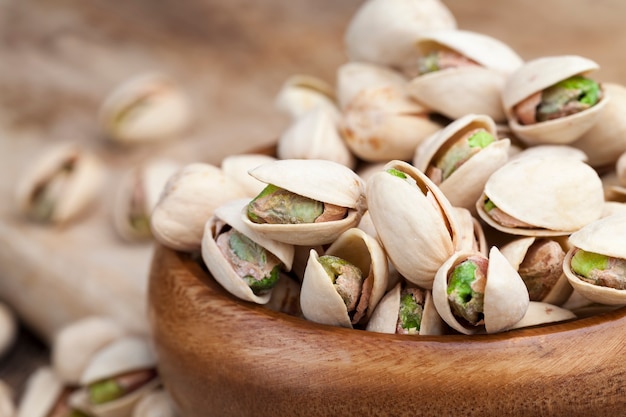 Ripe roasted pistachios sprinkled with salt, delicious natural dried and salted pistachio nuts