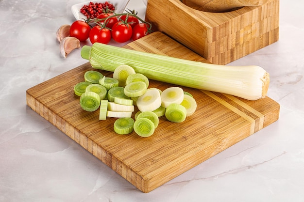 Ripe sliced leek onion over board