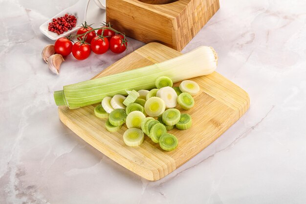 Ripe sliced leek onion over board