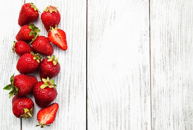 Ripe strawberries on wooden table