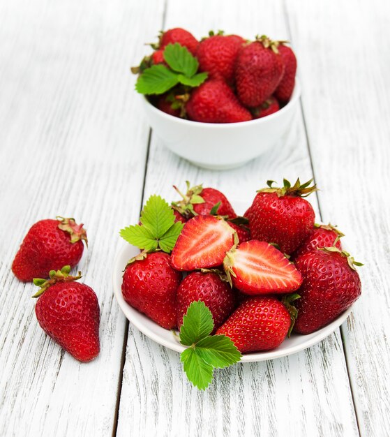 Ripe strawberries on wooden table