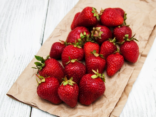 Ripe strawberries on wooden table