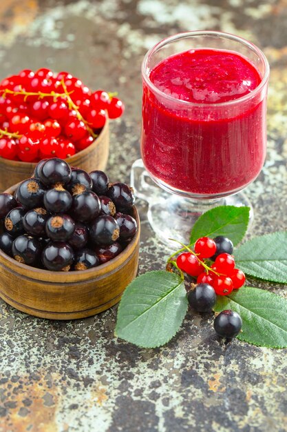 Ripe summer berries in a composition with drinks. 