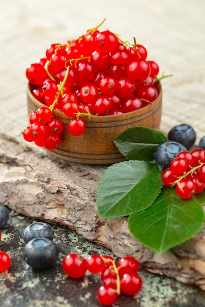 Ripe summer berries in a composition with drinks. 