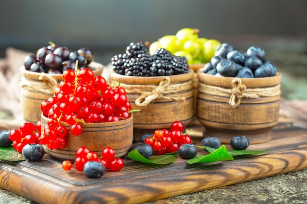 Ripe summer berries in a composition with drinks