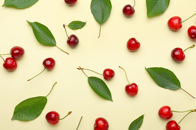 Photo ripe sweet cherry on color background