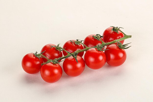 Ripe sweet cherry tomato branch isolated