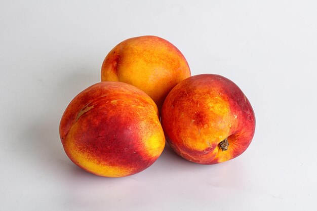 Ripe sweet juicy fresh red nectarines heap