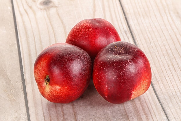 Ripe sweet juicy nectarines heap