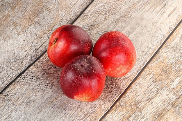 Ripe sweet juicy organic nectarines heap