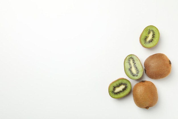 Ripe sweet kiwi on white surface