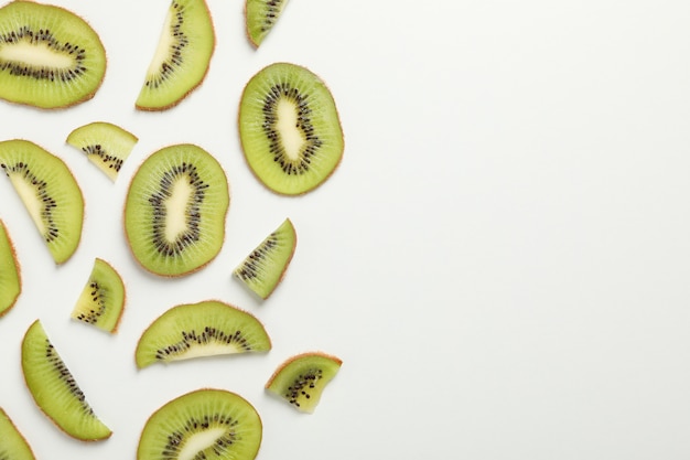 Ripe sweet kiwi on white surface