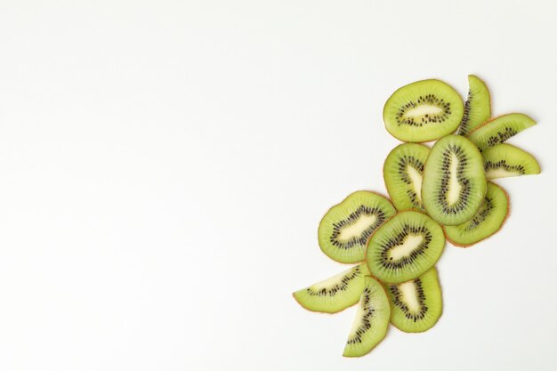 Ripe sweet kiwi on white surface