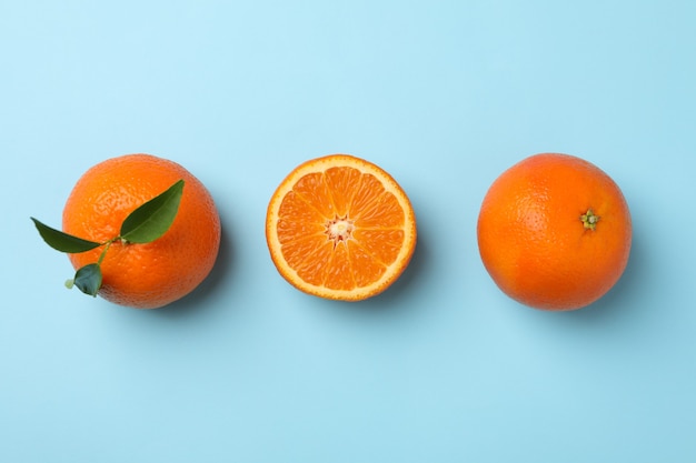 Ripe sweet mandarins on blue