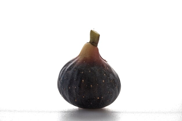 Ripe sweet one fig fruit on white