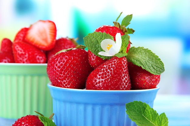 Ripe sweet strawberries in bowls