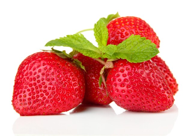 Ripe sweet strawberries and mint isolated on white