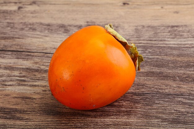 Photo ripe sweet and tasty persimmon