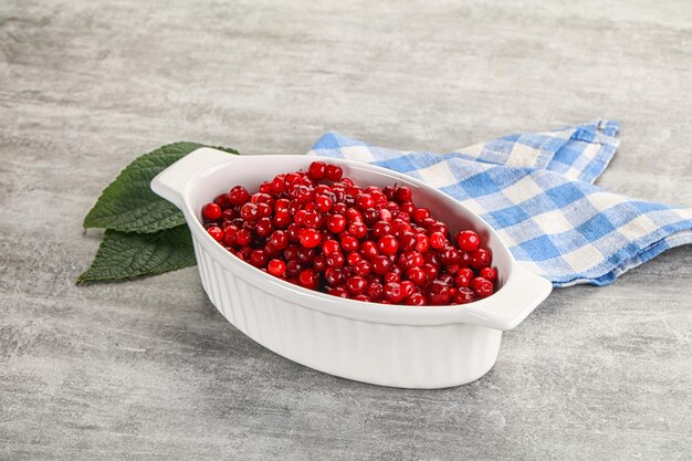 Ripe sweet wild organic cowberry in the bowl