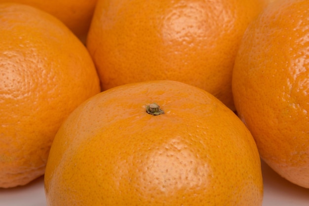 Ripe tangerines on a white background