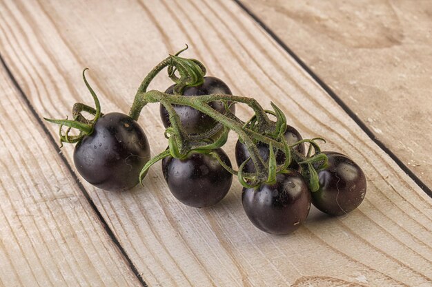 Ripe tasty black cherry tomato