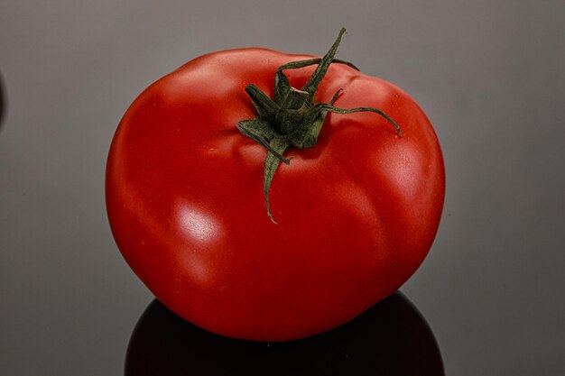 Ripe tasty and juicy tomato isolated background